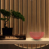Concord Kyoto Series fruit basket Amber color on display on a table next to a Japanese bonsai tree
