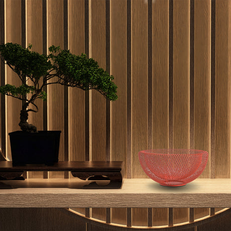 Concord Kyoto Series fruit basket Amber color on display on a table next to a Japanese bonsai tree